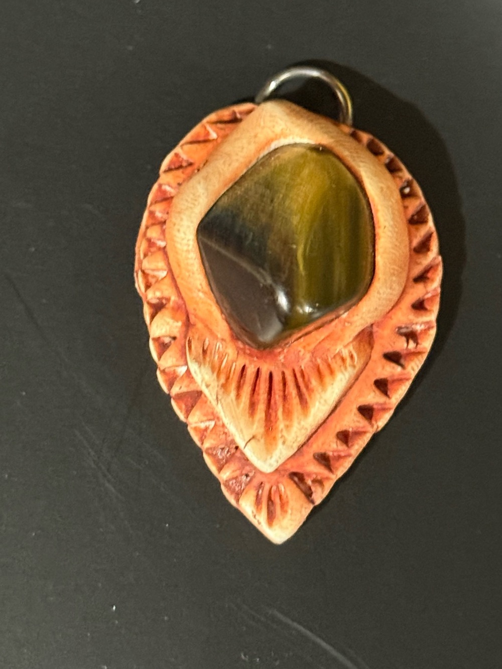 Tigers eye stone set in handcrafted material